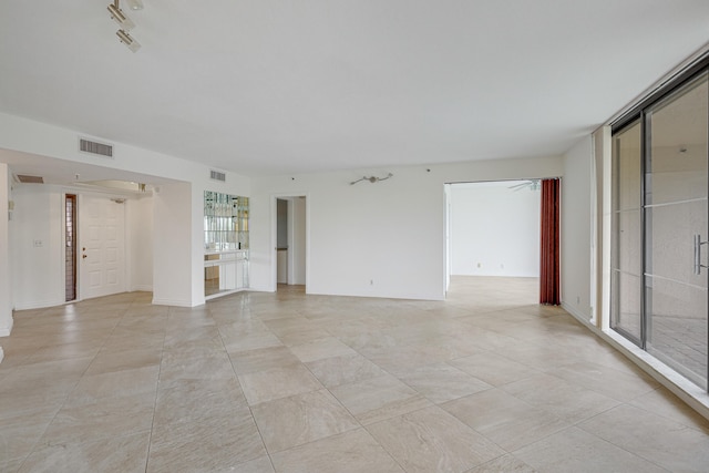 view of tiled spare room