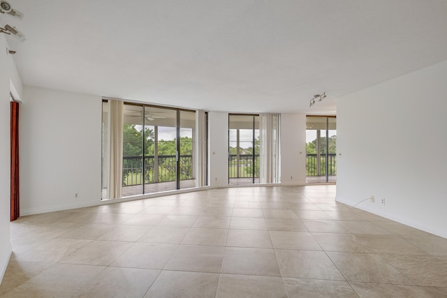 empty room with light tile patterned flooring