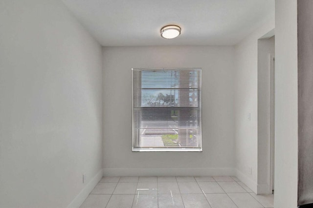 empty room with light tile patterned floors