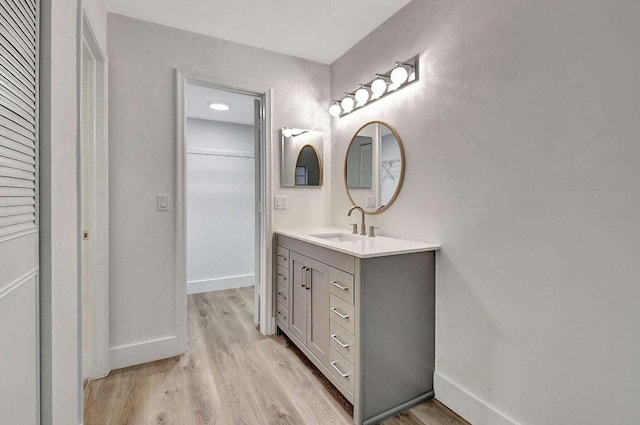 bathroom featuring vanity and wood-type flooring