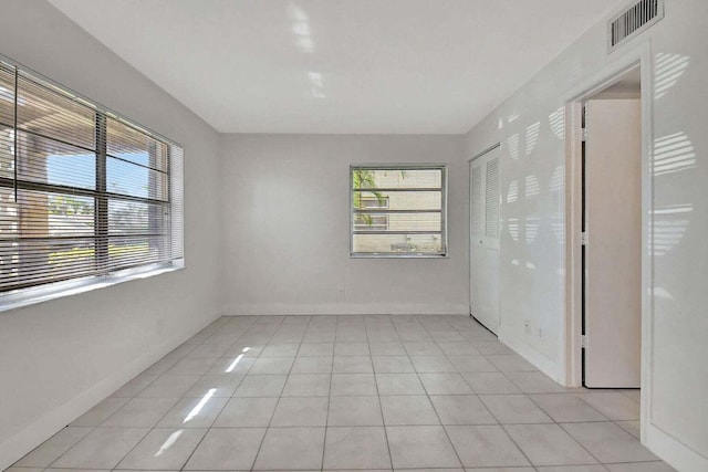 spare room with light tile patterned floors