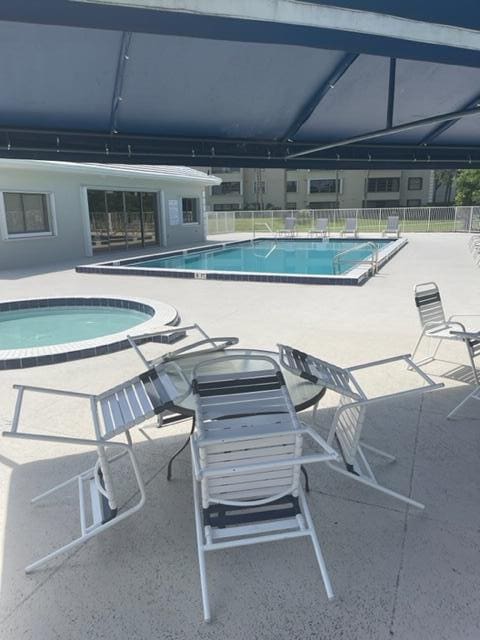 view of swimming pool with a patio