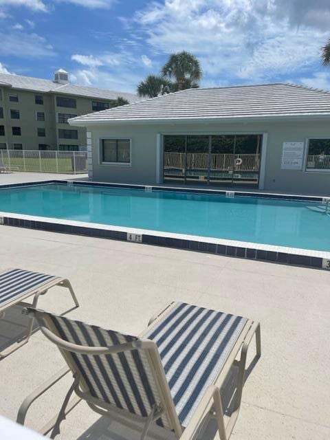 view of swimming pool with a patio area