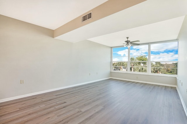 unfurnished room featuring hardwood / wood-style floors and ceiling fan