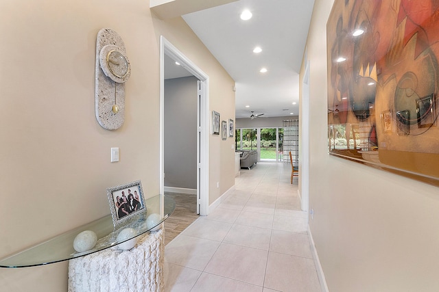 hallway featuring light tile patterned floors