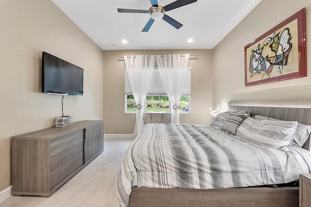 tiled bedroom featuring ceiling fan