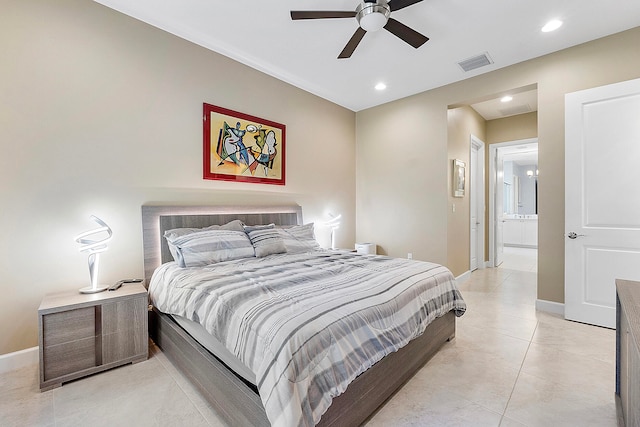 tiled bedroom featuring connected bathroom and ceiling fan