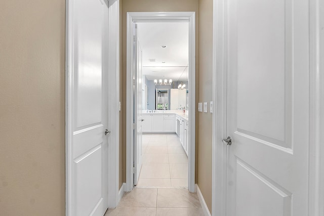 hall with light tile patterned flooring