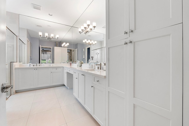 bathroom featuring vanity, tile patterned floors, and walk in shower