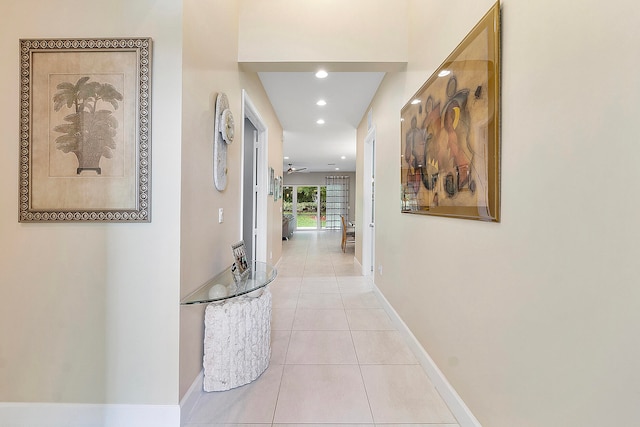 hall with light tile patterned floors