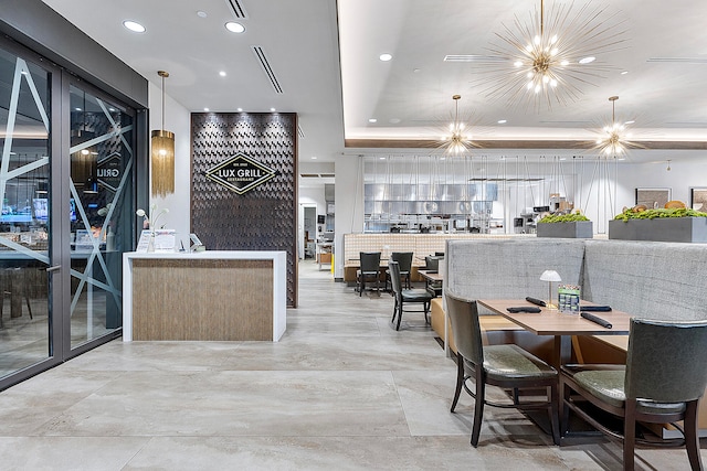 dining area featuring an inviting chandelier