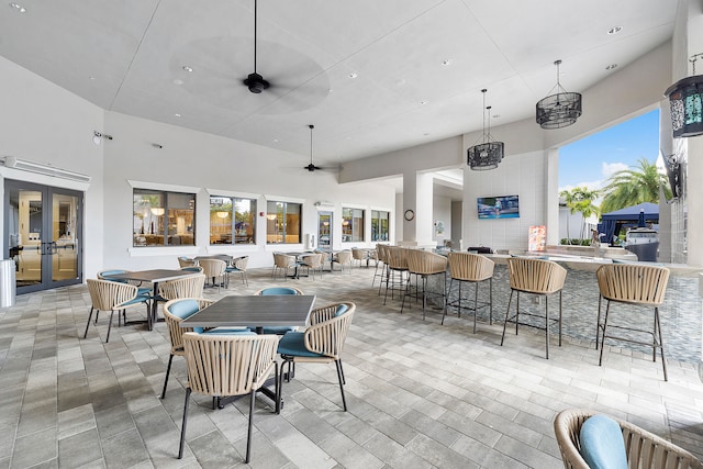 view of patio / terrace featuring french doors, ceiling fan, and an outdoor living space