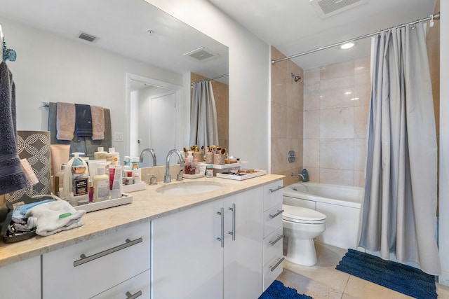 full bathroom with vanity, toilet, tile patterned floors, and shower / bath combo