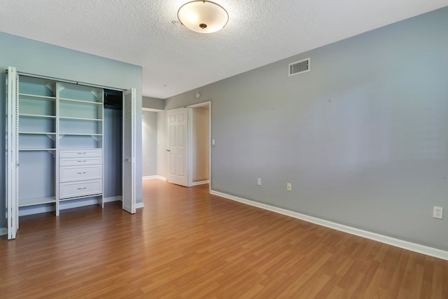 walk in closet featuring hardwood / wood-style flooring