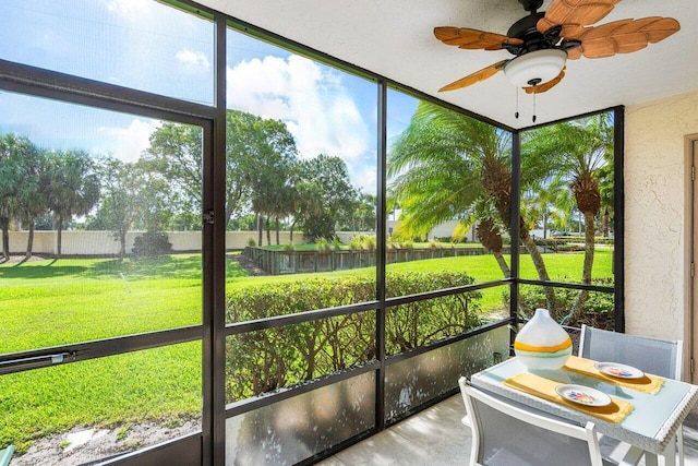 sunroom / solarium with ceiling fan