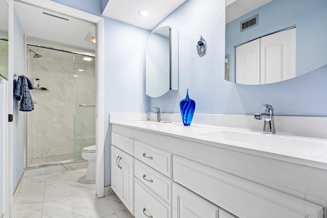 bathroom with toilet, an enclosed shower, and vanity