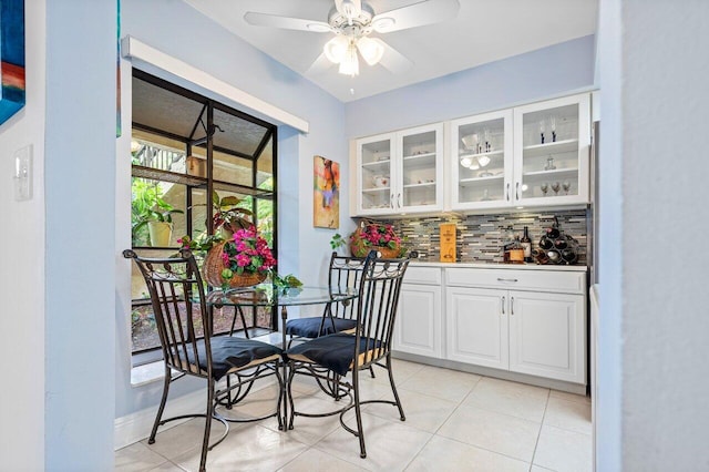 dining room featuring ceiling fan and light tile patterned flooring