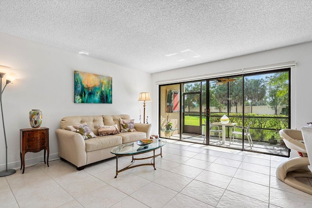 tiled living room featuring a textured ceiling and a wealth of natural light