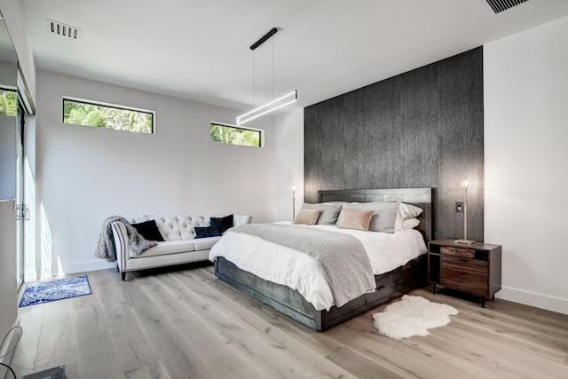 bedroom with light wood-type flooring