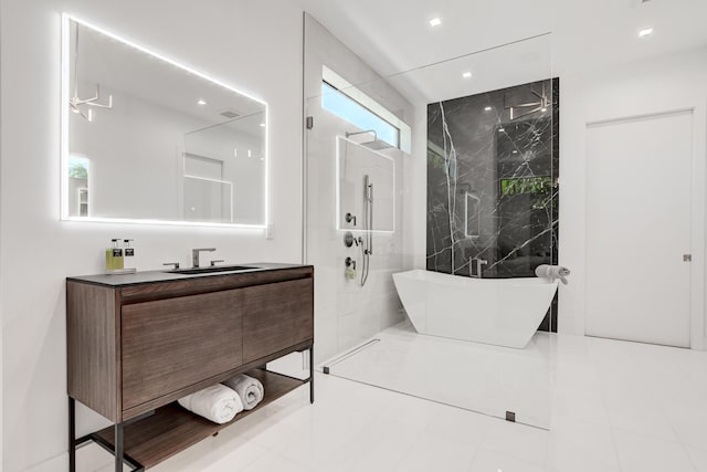 bathroom with vanity, plus walk in shower, and tile patterned floors