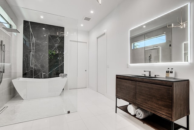 bathroom with vanity, shower with separate bathtub, and tile patterned flooring