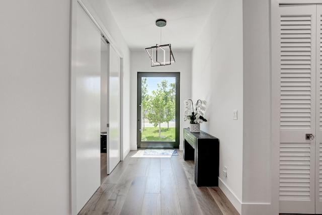 doorway to outside with light hardwood / wood-style flooring