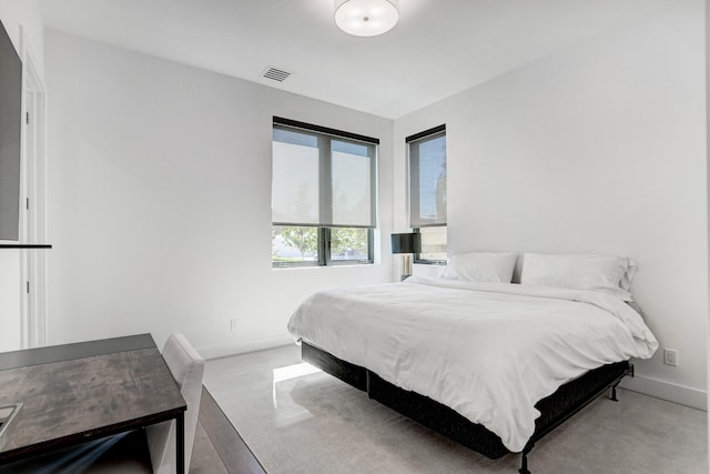 bedroom with light hardwood / wood-style flooring