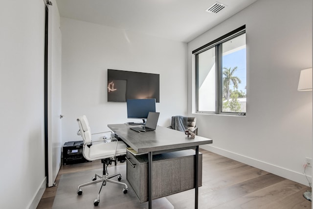 home office featuring light hardwood / wood-style flooring