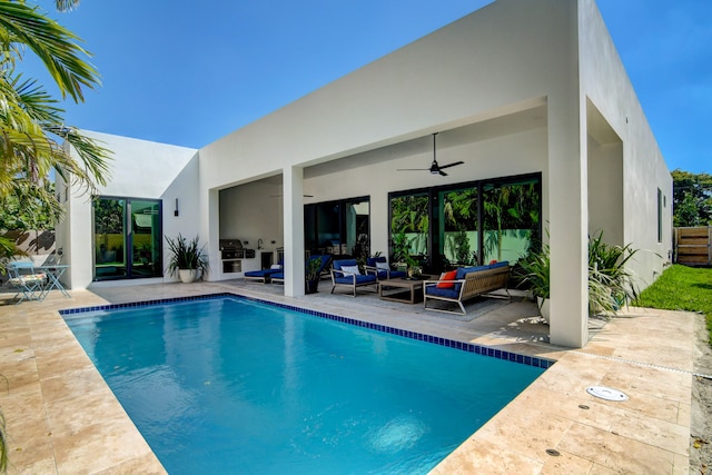 view of pool featuring a patio, ceiling fan, grilling area, and an outdoor hangout area