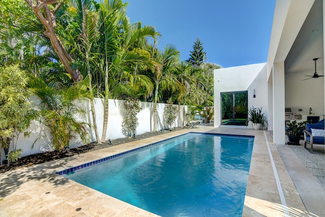 view of pool featuring sink, a patio area, and ceiling fan