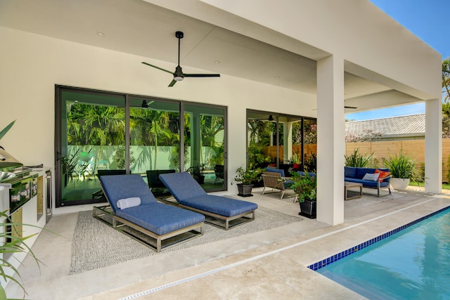 view of patio featuring ceiling fan, a fenced in pool, and an outdoor hangout area