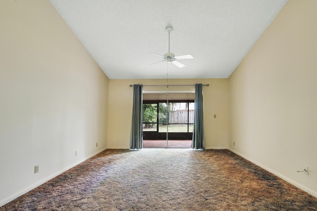 empty room with lofted ceiling, a textured ceiling, ceiling fan, and carpet floors