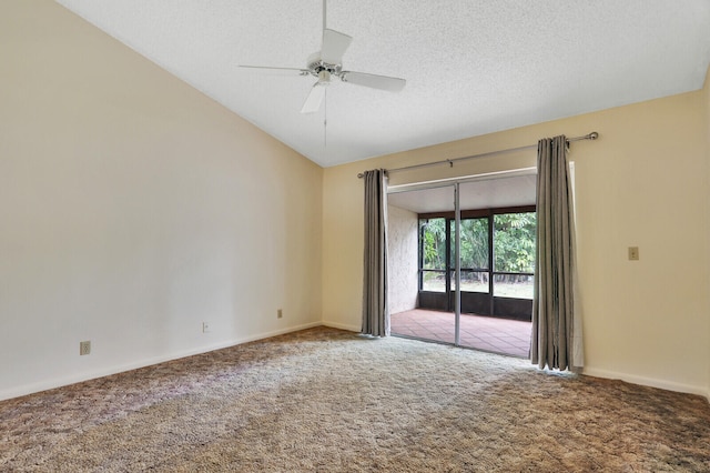 unfurnished room with a textured ceiling, carpet, ceiling fan, and vaulted ceiling