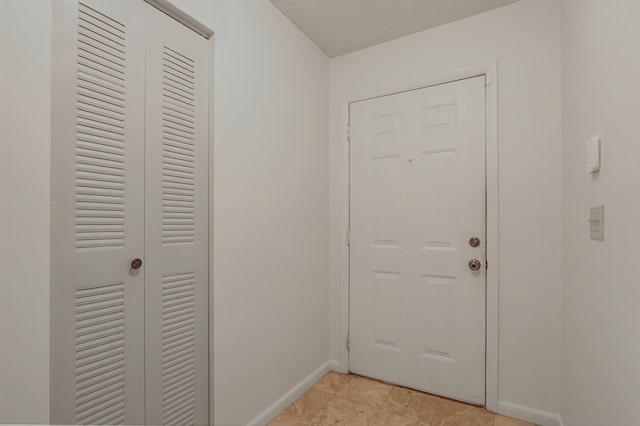 entryway featuring light tile patterned flooring