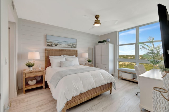 bedroom featuring ceiling fan and light hardwood / wood-style flooring