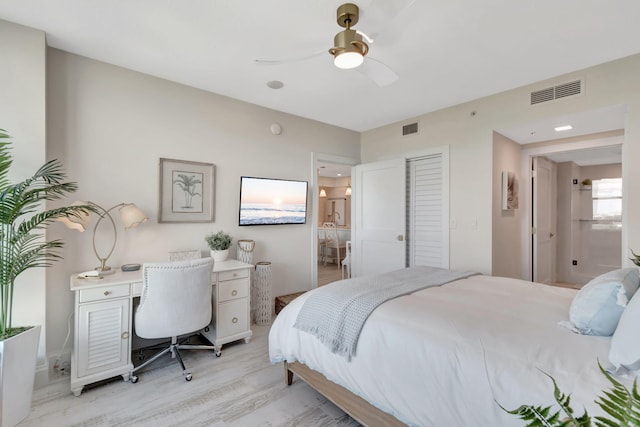 bedroom featuring ceiling fan and light hardwood / wood-style flooring