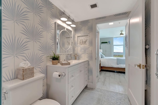 bathroom with toilet, tile patterned floors, and an enclosed shower