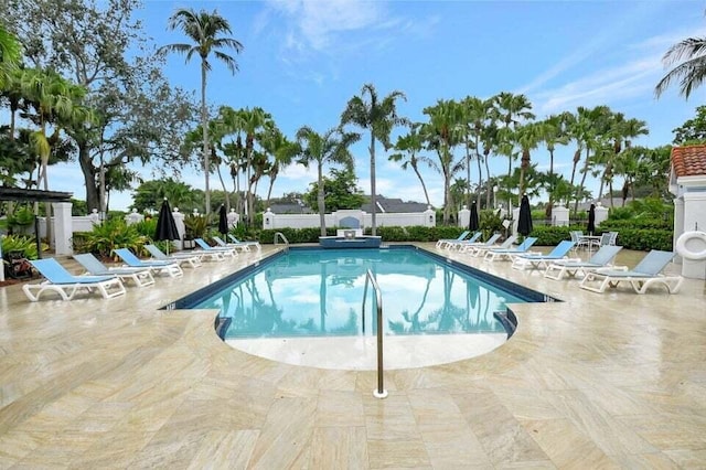 view of swimming pool featuring a patio