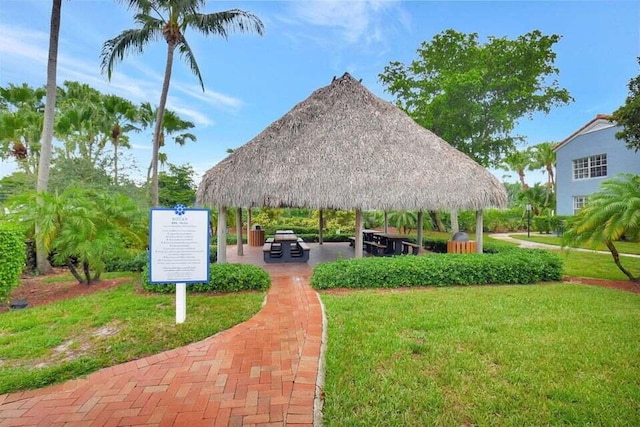 view of property's community with a gazebo and a lawn