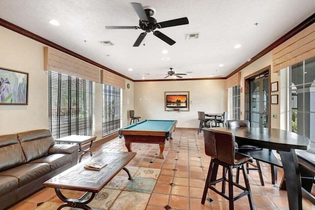 game room with pool table, ornamental molding, ceiling fan, and light tile patterned floors