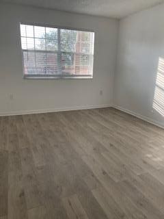 spare room featuring dark hardwood / wood-style floors