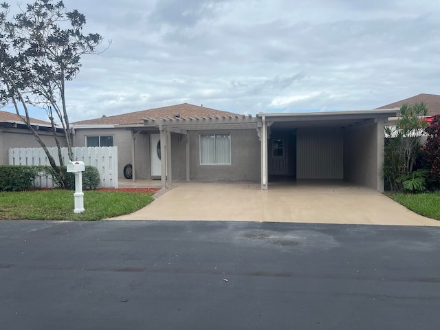 view of front of property with a carport