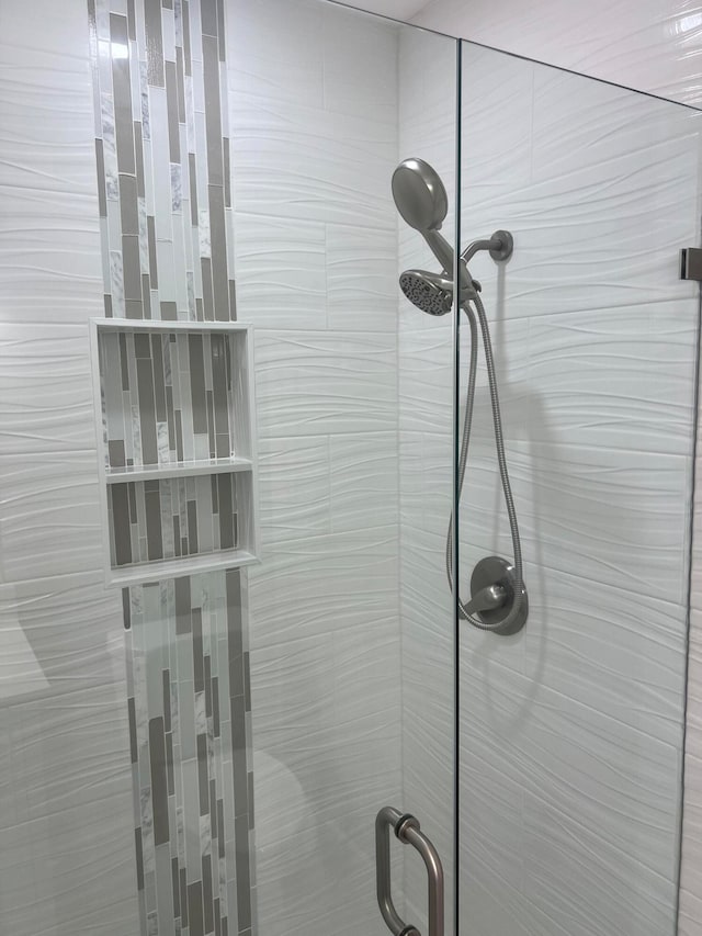 room details featuring a shower with shower door