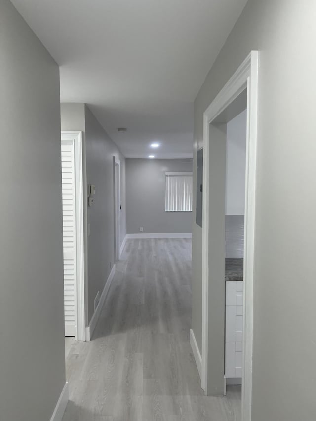 14910 Wildflower Ln, Delray Beach, FL 33446 - corridor with light wood-style flooring and baseboards