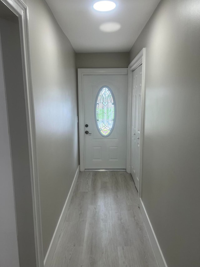 entryway with light hardwood / wood-style flooring