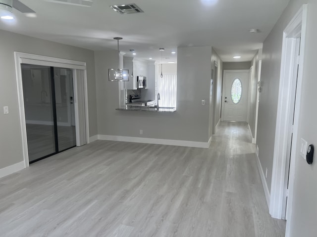14910 Wildflower Ln, Delray Beach, FL 33446 - unfurnished living room with baseboards and light wood finished floors