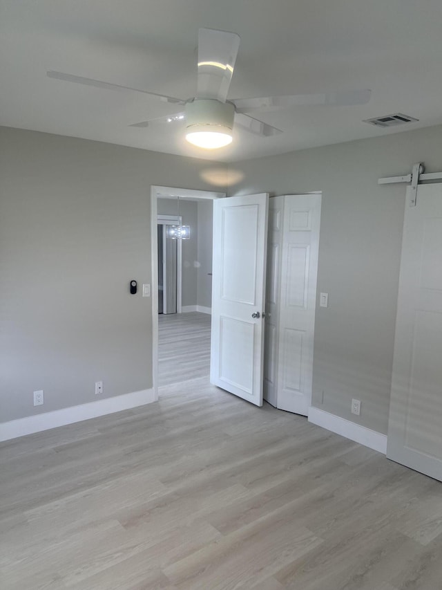 14910 Wildflower Ln, Delray Beach, FL 33446 - empty room with light wood finished floors, baseboards, and ceiling fan