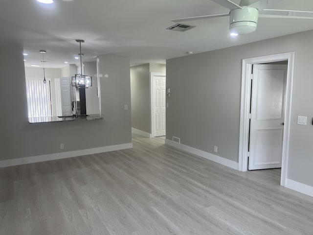 14910 Wildflower Ln, Delray Beach, FL 33446 - unfurnished living room with baseboards, light wood-style floors, recessed lighting, and a chandelier