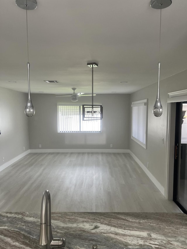 14910 Wildflower Ln, Delray Beach, FL 33446 - unfurnished dining area featuring wood finished floors and baseboards