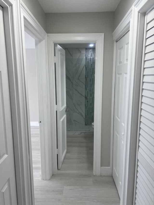 14910 Wildflower Ln, Delray Beach, FL 33446 - corridor featuring light wood finished floors and baseboards